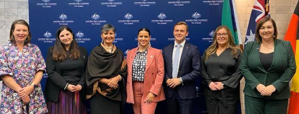 Members of the Australian Political Exchange Council Alumni with Australian flags.